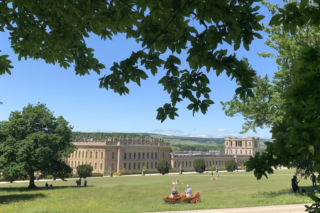 Image of Chatswort House taken from the gardens in summer time