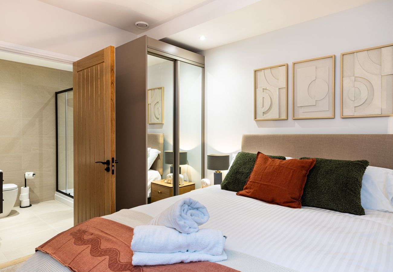 Image showing the bedroom and modern ensuite inside Rock Mill Apartment 4