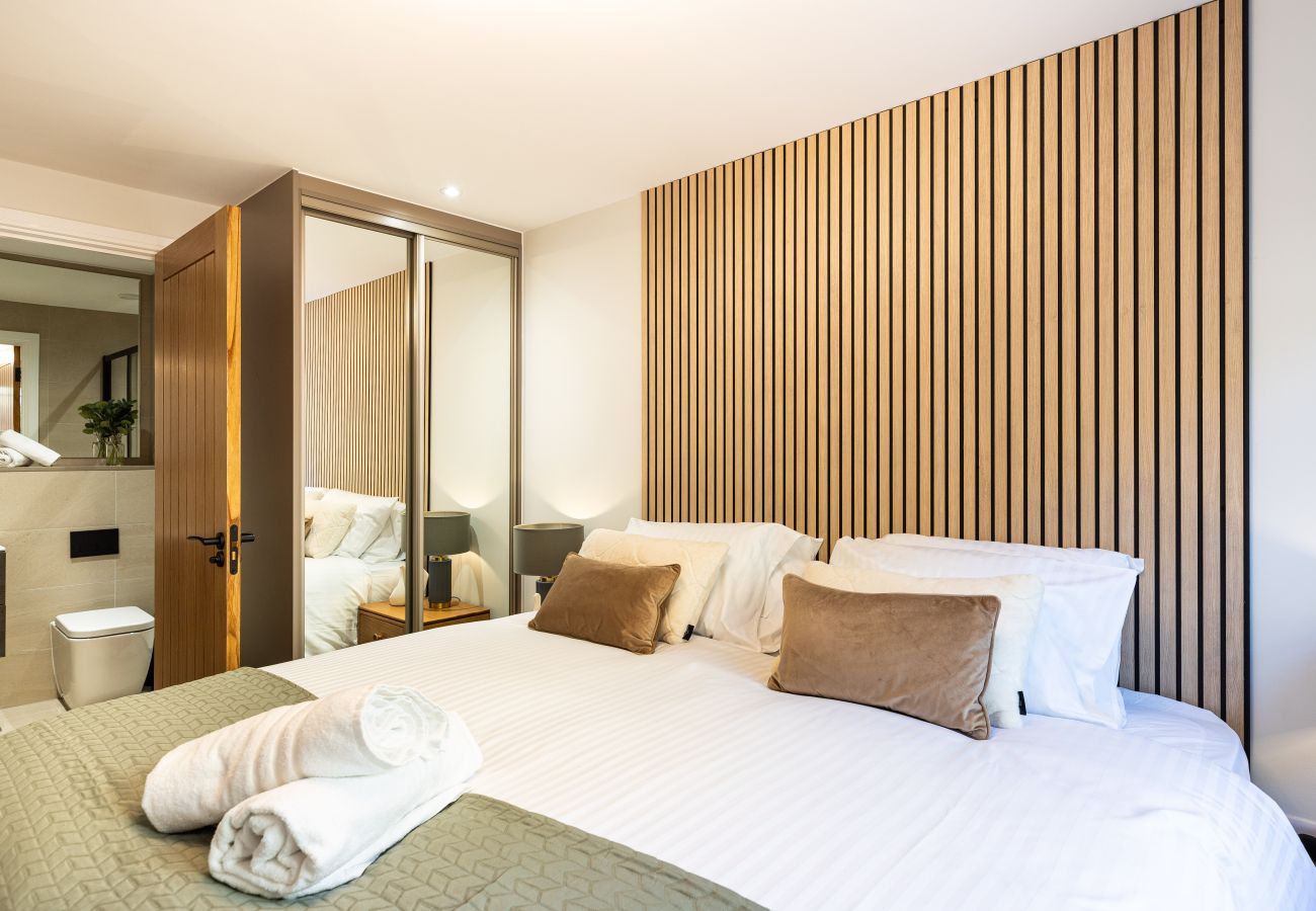Image showing the bedroom and modern ensuite inside Rock Mill Apartment 19
