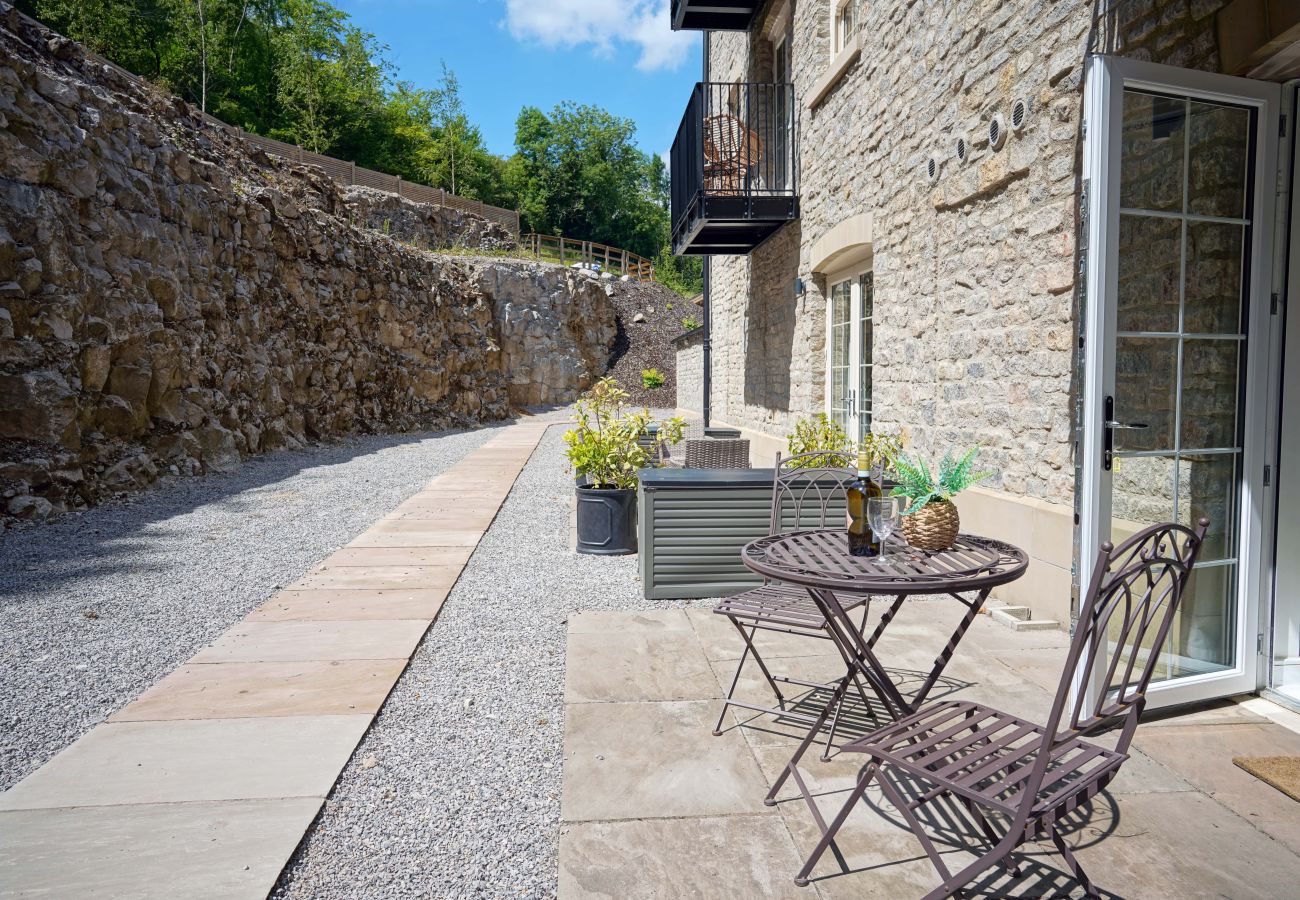 Image showing the outdoor patio area with seating for two at Rock Mill Apartment 7