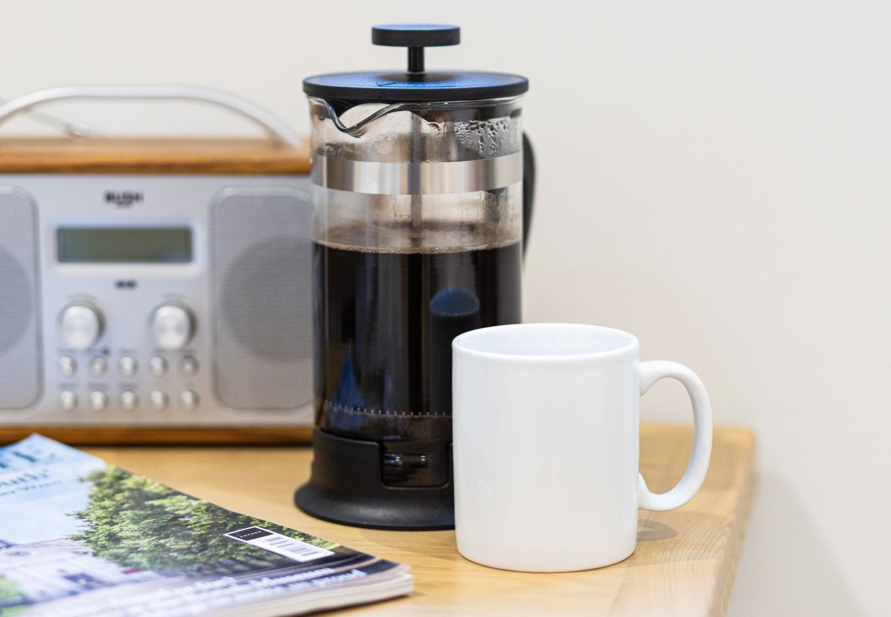 Image showing a bush dab radio and coffee inside Rock mill apartment 21