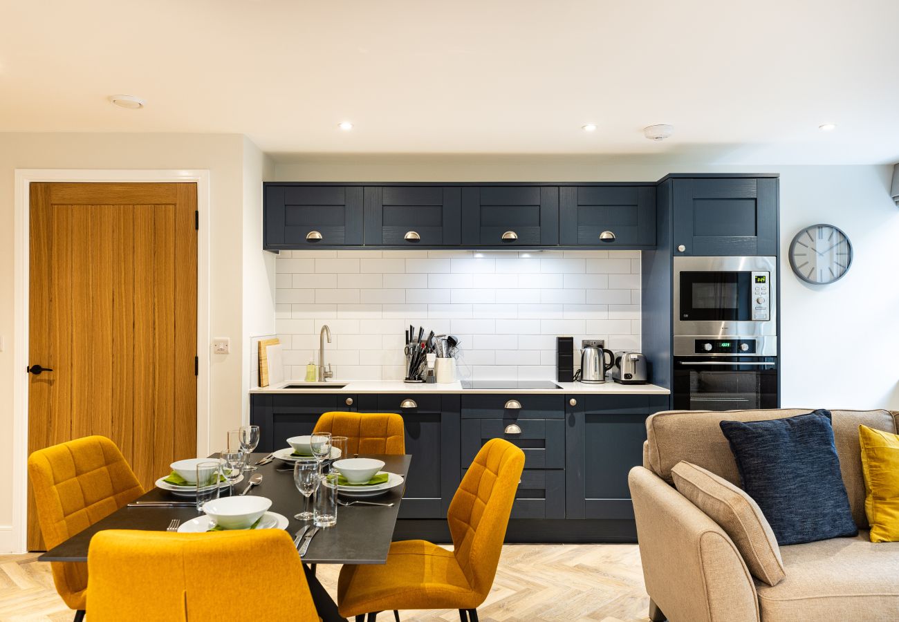 Images shows the interior of Apartment 12 with Kitchen, Dining for 4 and open plan living space