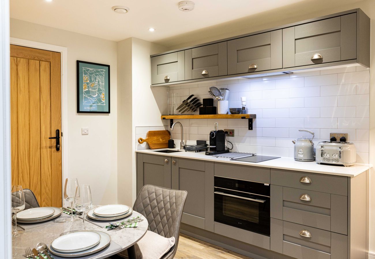 Image showing the fully equipped integrated kitchen inside apartment 27 at Rock Mill