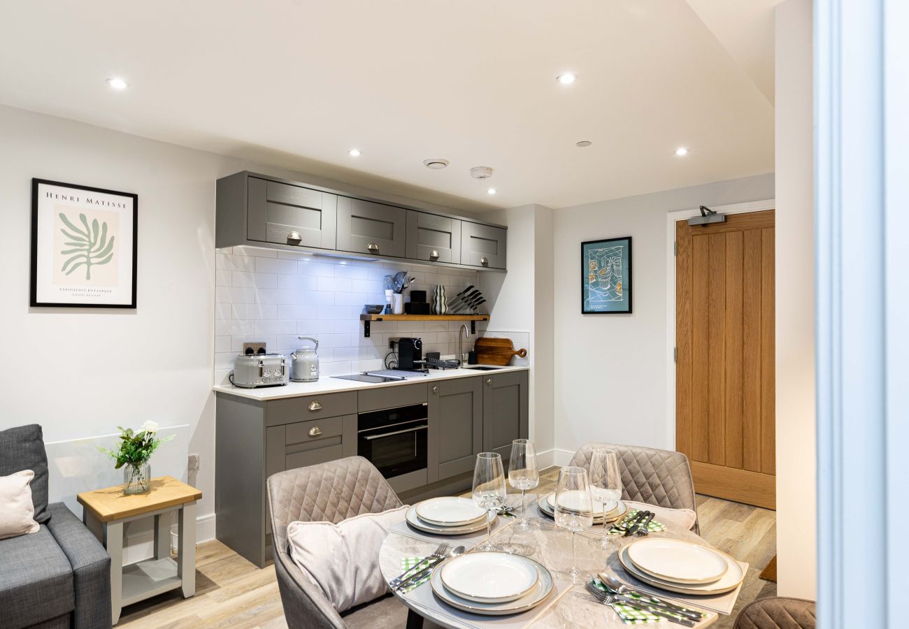 Image of the integrated kitchen with dining area inside apartment 32 at rock mill