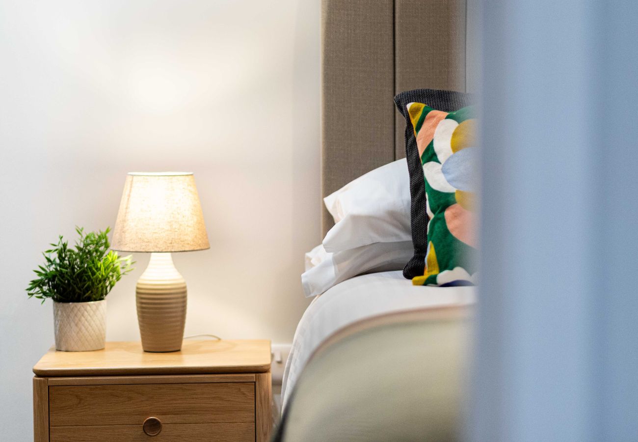 Image showing the warm lighting inside rock mill apartment 32 bedroom