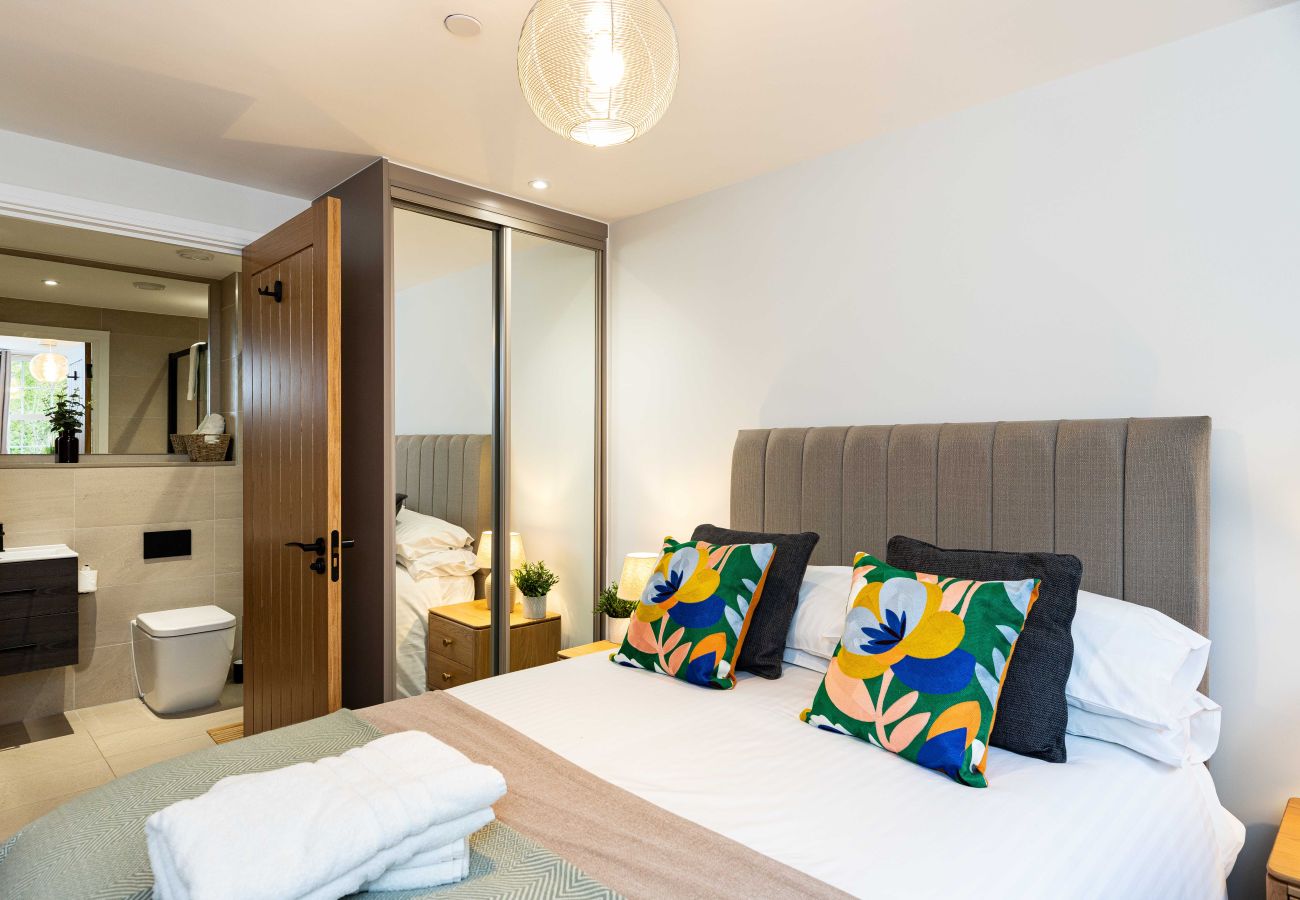 Image of the bedroom with modern ensuite inside apartment 32 at rock mill apartments