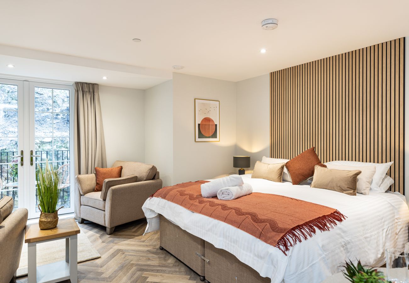 Image showing the comfortable combined bedroom and living space inside studio apartment 16