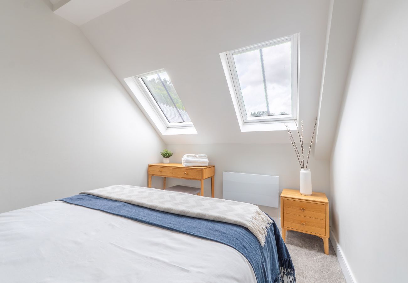 Image shows a light and airy bedroom on the first floor of Apartment 41